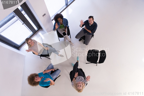 Image of Multiethnic startup business team on meeting  top view