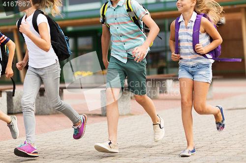 Image of group of happy elementary school students running