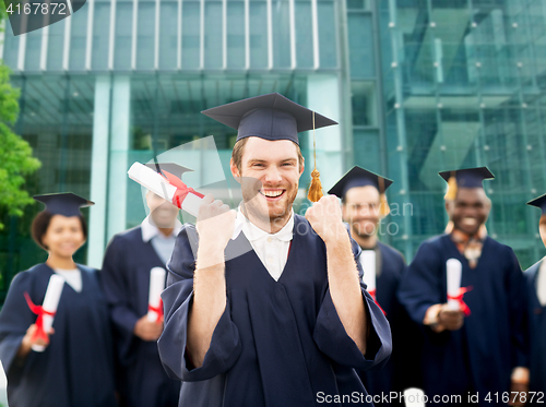 Image of happy student with diploma celebrating graduation