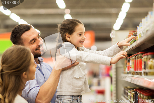 Image of happy family buying food at grocery store