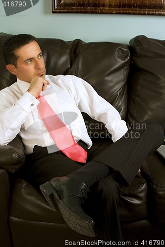 Image of Businessman Sitting on the Couch