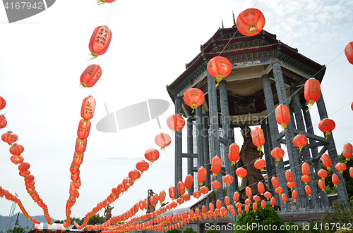 Image of Guanyin and a red lanterns in Chinese Temple Penang, Malaysia