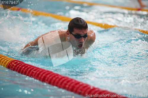 Image of  swimmer in motion in a spray of water