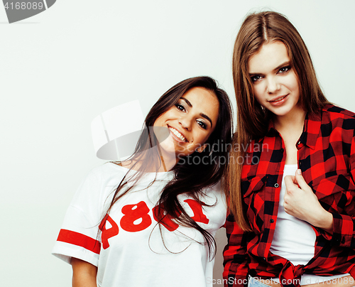 Image of best friends teenage girls together having fun, posing emotional on white background, besties happy smiling, lifestyle people concept, blond and brunette multi nations 