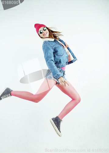 Image of lifestyle people concept: happy smiling hipster girl jumping on white background isolated