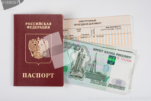 Image of Passport, money and a train ticket, top view, white background