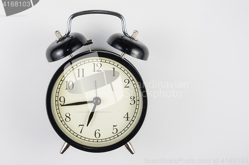 Image of Alarm clock on a white background, to the right place for an inscription