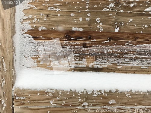 Image of old wood covered with snow background