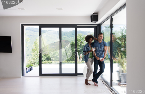 Image of romantic happy young couple relax at modern home indoors