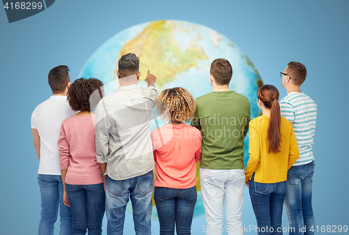 Image of group of people pointing to something