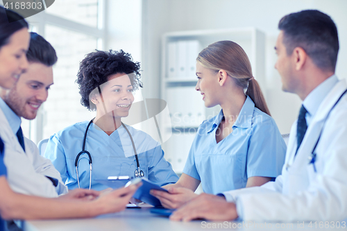 Image of group of happy doctors meeting at hospital office