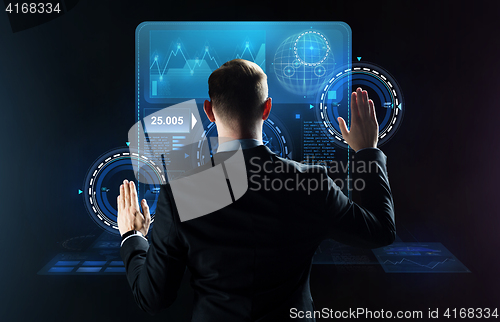 Image of businessman working with virtual screens