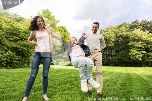 Image of happy family walking in summer park and having fun