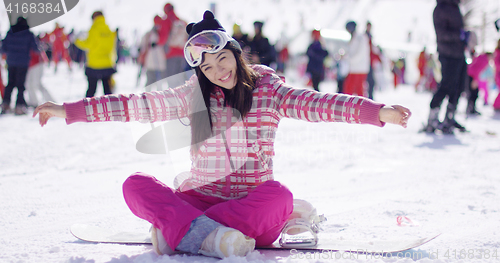 Image of Carefree young woman on skiing holiday