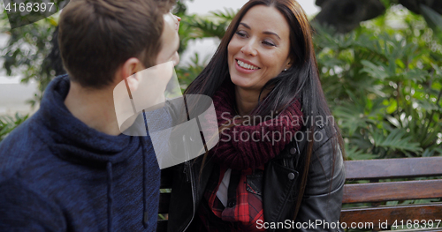 Image of Middle aged attractive couple in park