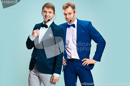 Image of Portrait of a handsome customer service operator wearing a headset