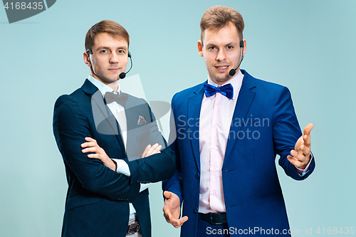 Image of Portrait of a handsome customer service operator wearing a headset