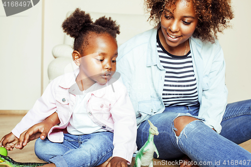 Image of adorable sweet young afro-american mother with cute little daugh