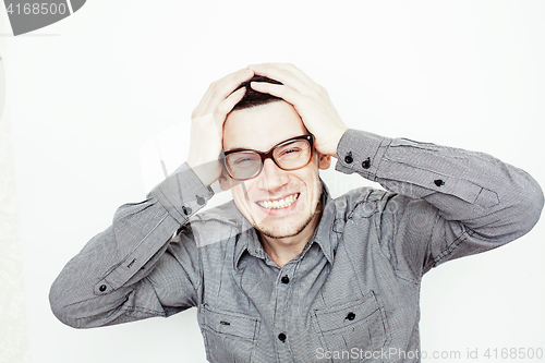 Image of young handsome well-groomed guy posing emotional on white background, lifestyle people concept