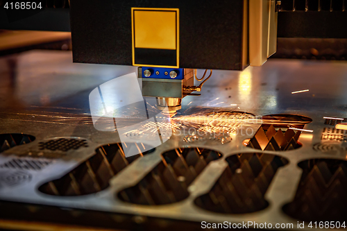 Image of CNC Laser cutting of metal, modern industrial technology. .