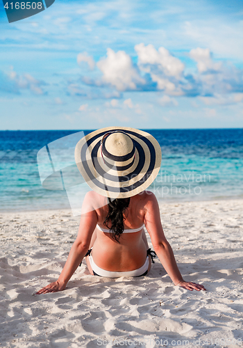 Image of Woman and tropical beach in the Maldives.