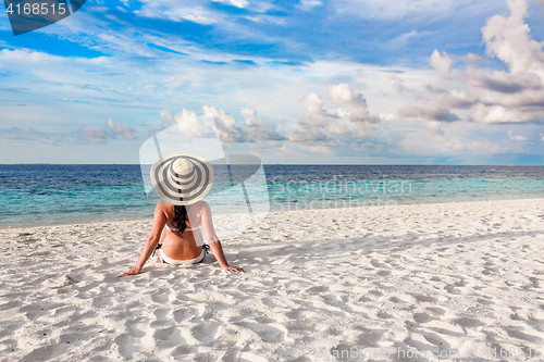 Image of Woman and tropical beach in the Maldives.