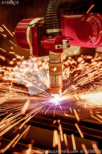 Image of CNC Laser plasma cutting of metal, modern industrial technology.