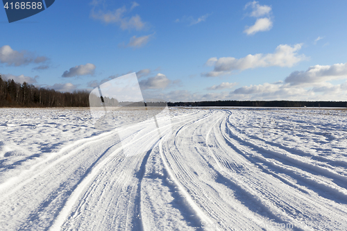 Image of traces of the car on snow