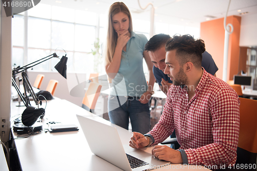 Image of Group of young people employee workers with computer