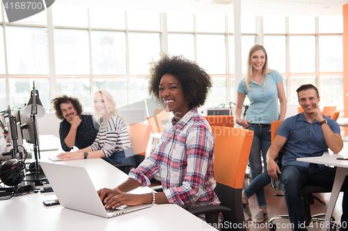 Image of African American informal business woman working in the office