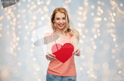 Image of happy woman or teen girl with red heart shape