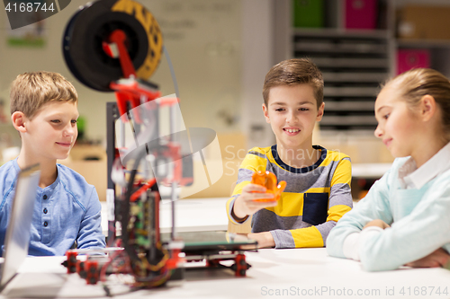 Image of happy children with 3d printer at robotics school