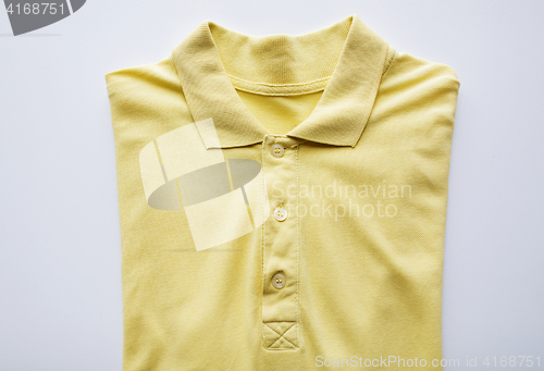 Image of close up of polo t-shirt on white background