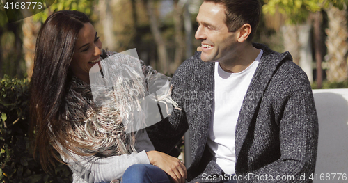 Image of Happy young couple enjoying the autumn sunshine