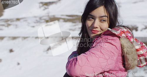 Image of Beautiful woman in snowy mountains