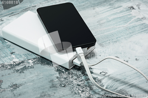 Image of Power bank and mobile phone