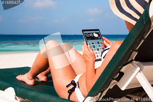 Image of Woman with a tablet in hands