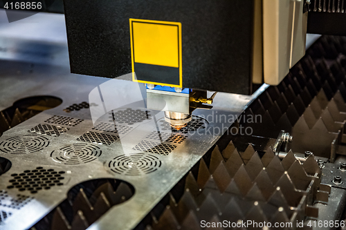 Image of CNC Laser cutting of metal, modern industrial technology. .