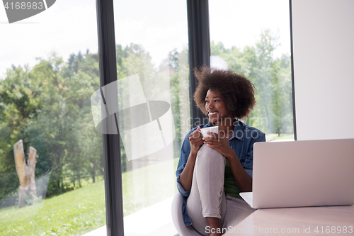 Image of African American woman in the living room