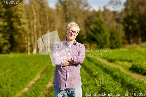 Image of happy senior man at farm