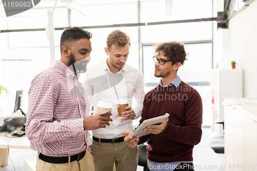 Image of business team with tablet pc and coffee at office