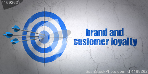 Image of Advertising concept: target and Brand and Customer loyalty on wall background