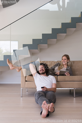 Image of young couple relaxes in the living room