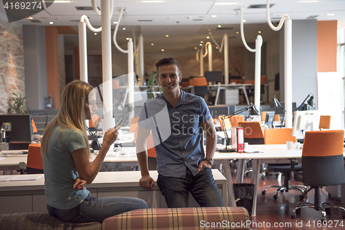 Image of startup business couple in a modern office