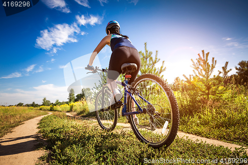 Image of Women on bike