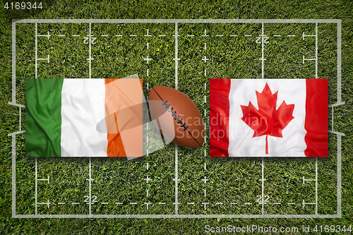 Image of Ireland vs. Canada\r flags on rugby field