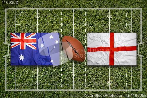 Image of Australia vs. England\r flags on rugby field