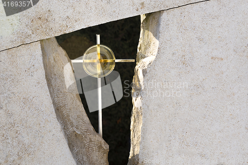 Image of Golden cross in a grave stone