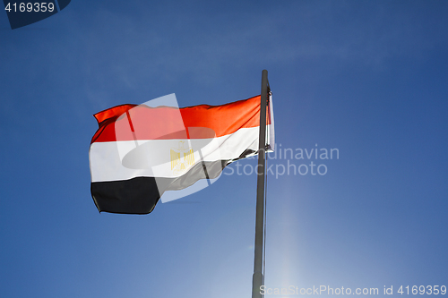 Image of National flag of Egypt on a flagpole