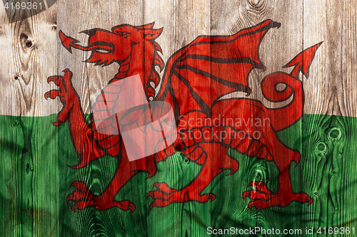 Image of National flag of Wales, wooden background